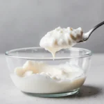 Greek yogurt protein per 100g close-up spoonful