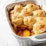Close-up of peach cobbler in ceramic dish
