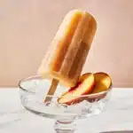 Sweet Tea Peach Popsicles close-up with fresh peaches