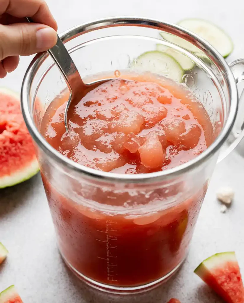 making-watermelon-juice-for-gummies Straining fresh watermelon juice for the watermelon gummies recipe.