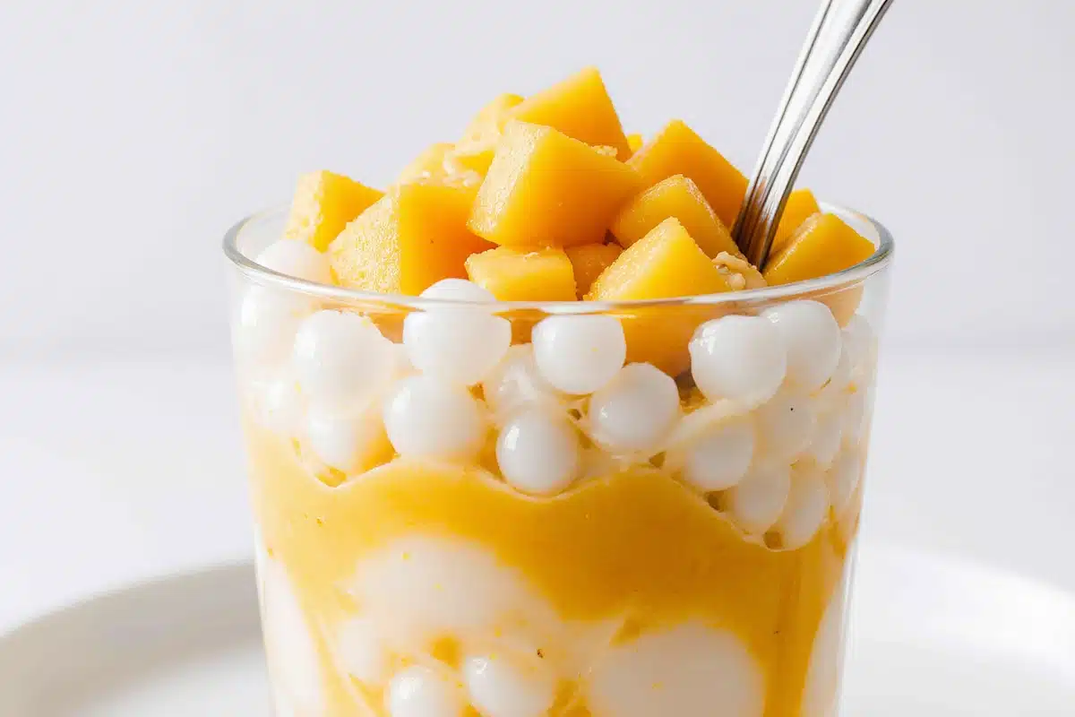 Mango sago dessert creamy Asian sweet with coconut, tapioca, and fresh mango cubes