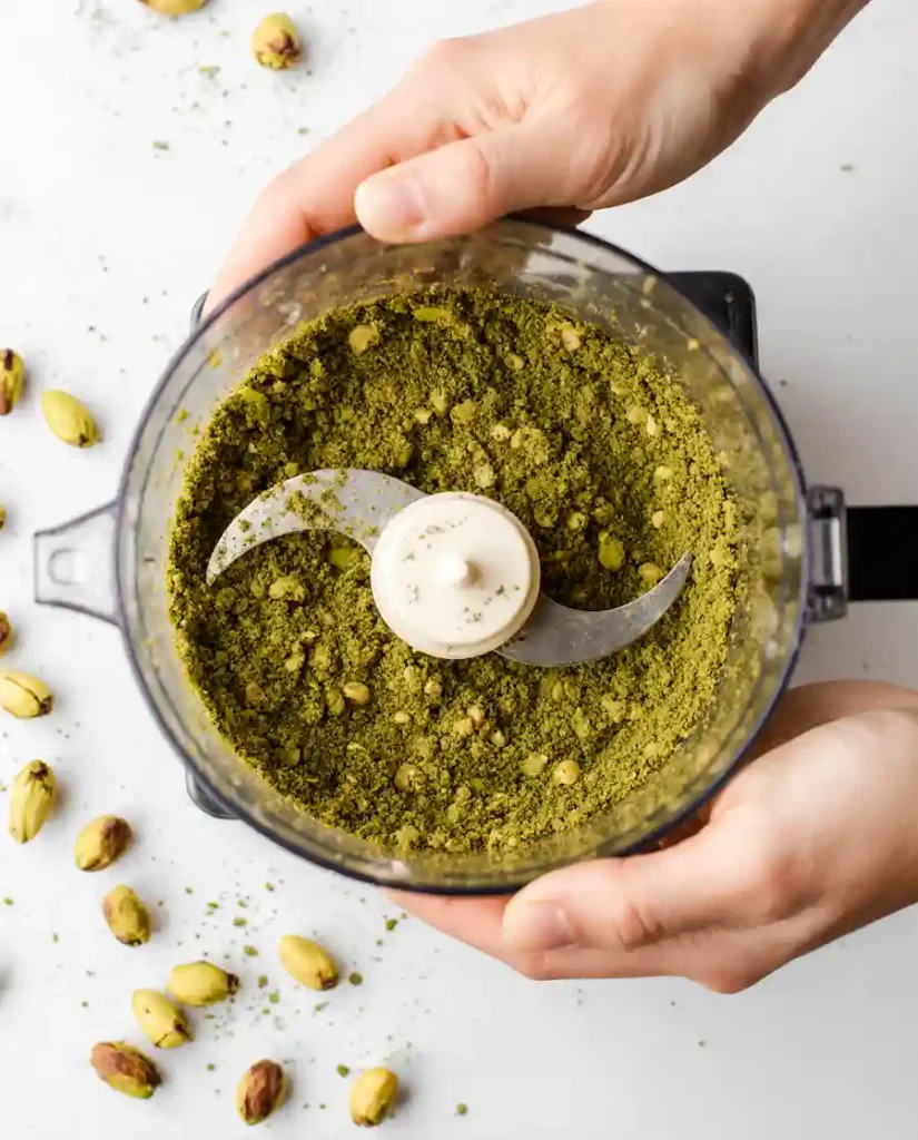 pistachio-cake-recipe-process how to make pistachio cake recipe - grinding pistachios in food processor