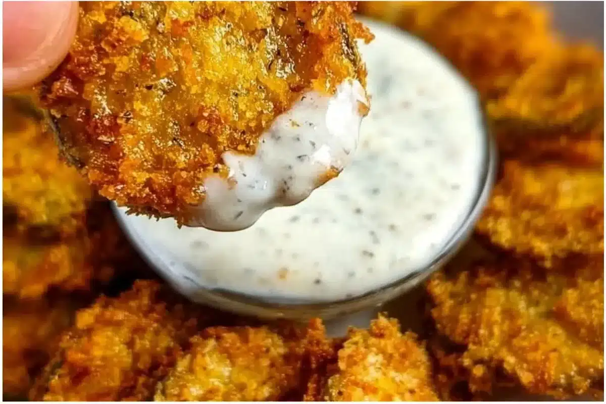 Plate of crispy air fryer fried pickles with dipping sauce