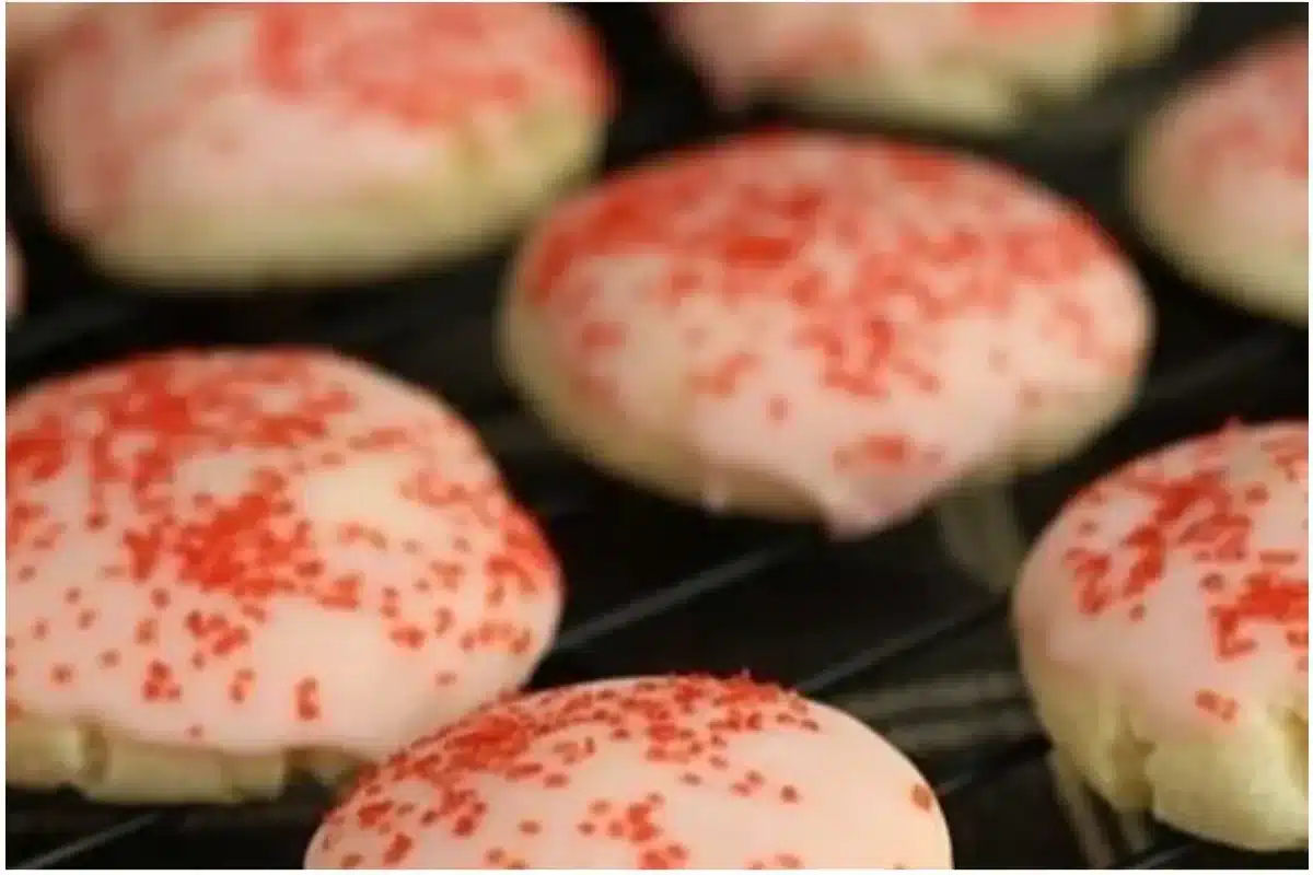 Freshly baked Almond Cherry Cookies with nuts and cherries on a plate