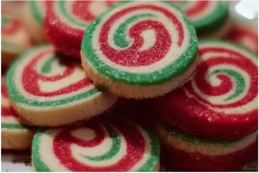 Colorful Christmas Pinwheel Cookies arranged on a festive platter.