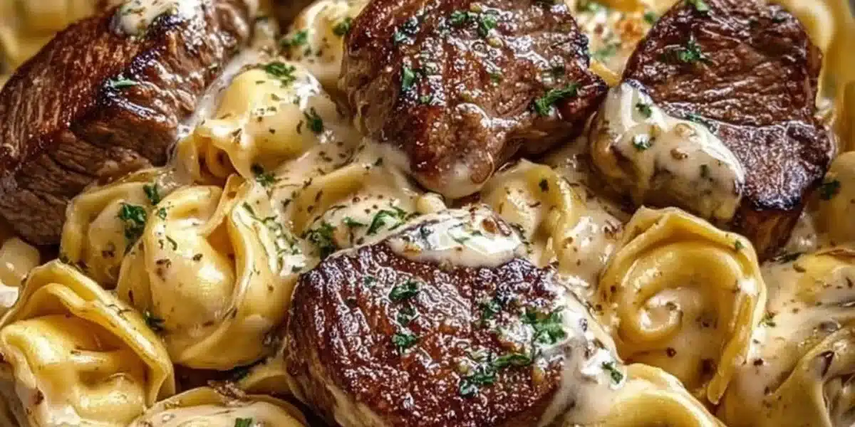 Delicious Cracked Garlic Steak Tortellini served in creamy sauce with herbs