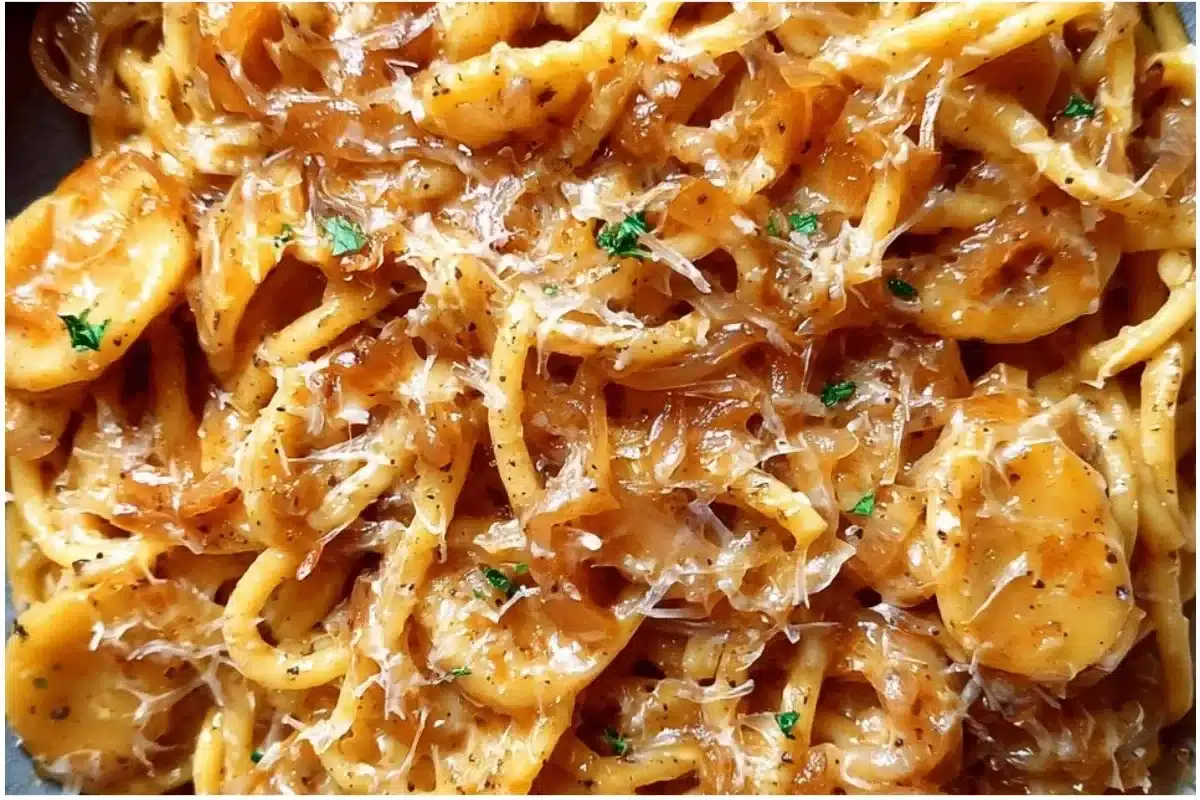 Delicious Easy French Onion Pasta served in a bowl topped with cheese and herbs