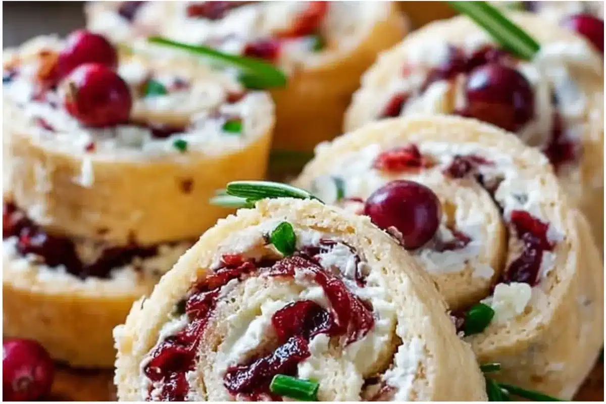 Festive Christmas Cranberry Roll Ups served on a holiday platter