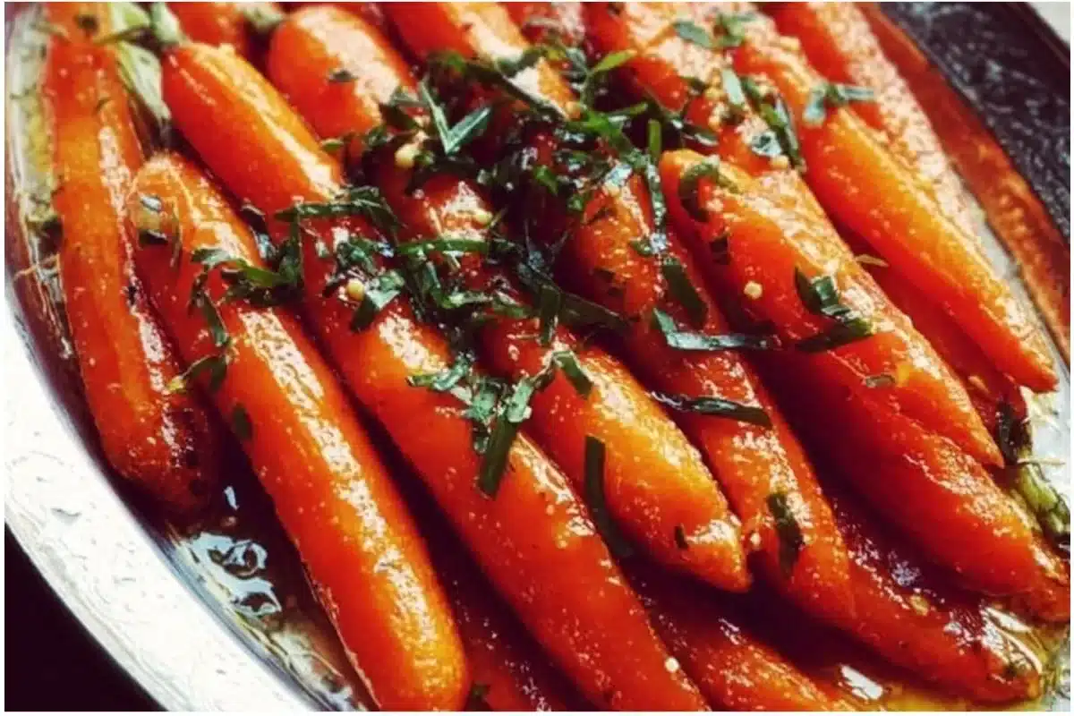 Delicious honey glazed carrots served in a bowl, showcasing their shiny texture.