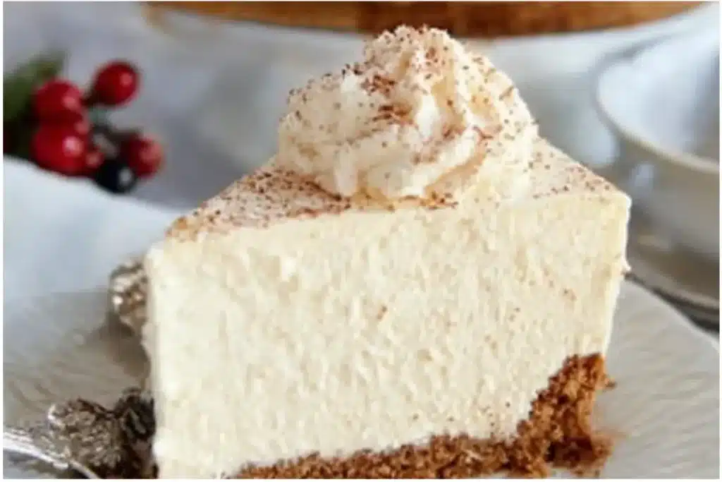 No-Bake Eggnog Cheesecake with Gingersnap Crust - Cheesecake It Is! 17 No-Bake Eggnog Cheesecake with Gingersnap Crust served on a festive plate