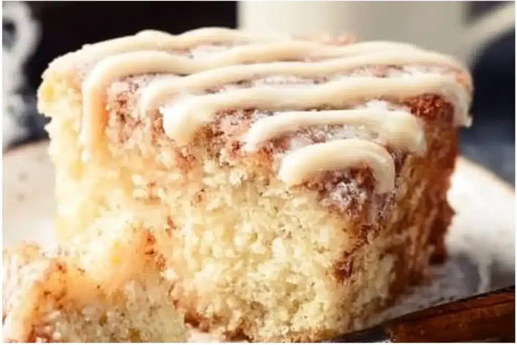 Slice of Overnight Eggnog Coffee Cake on a festive plate