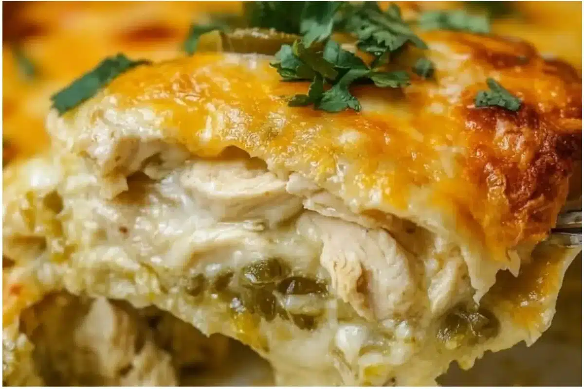 Quick and easy green chile chicken enchilada casserole served in a colorful dish