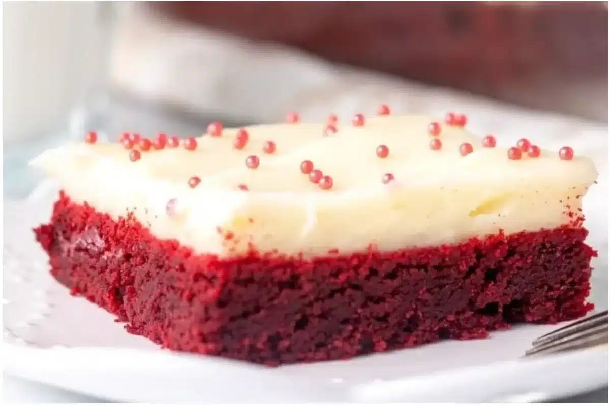 Delicious Red Velvet Cookie Bars topped with cream cheese frosting
