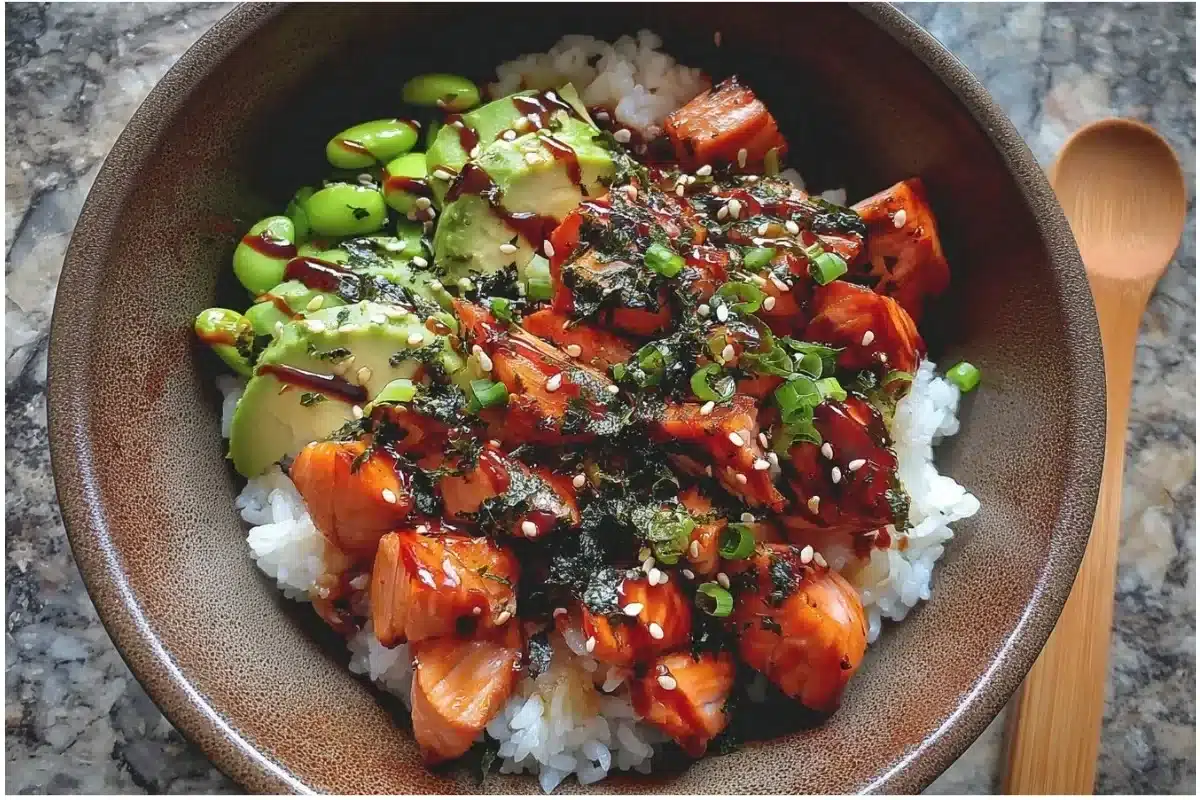 Delicious sticky gluten-free teriyaki salmon sushi bowl garnished with fresh vegetables