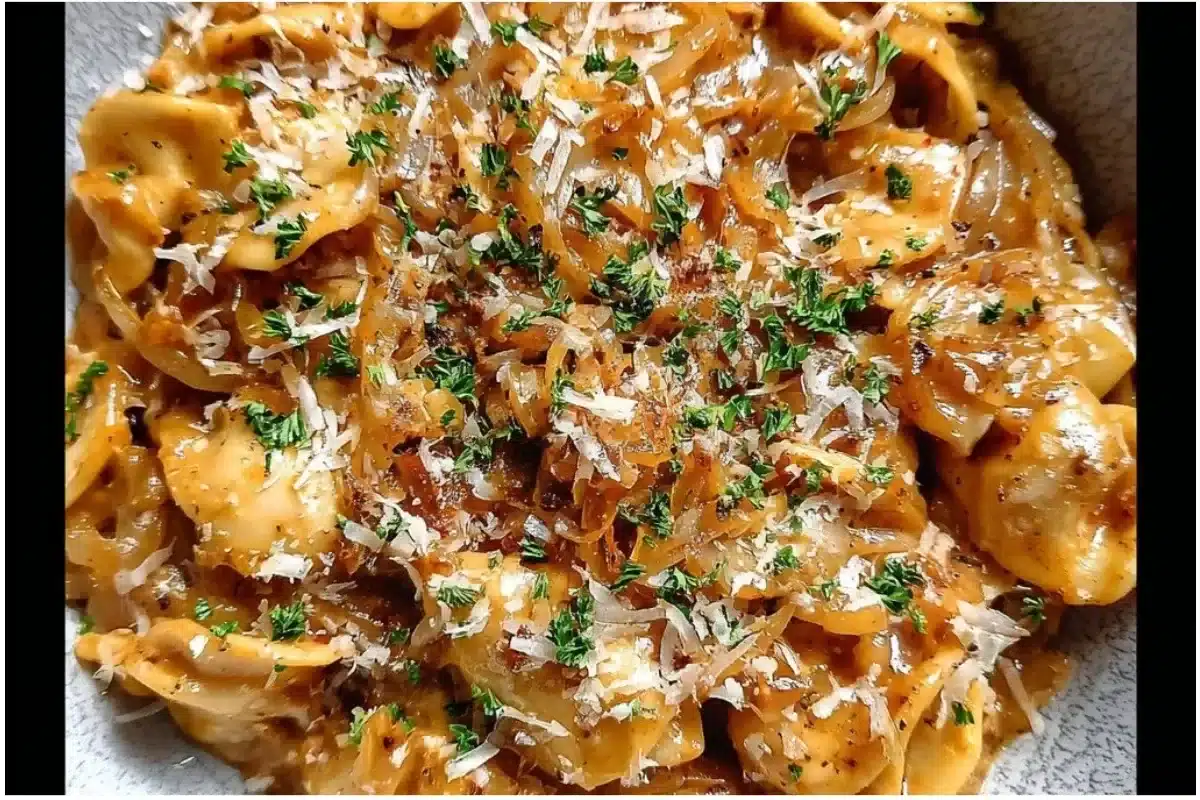 Delicious Easy French Onion Pasta topped with melted cheese and caramelized onions