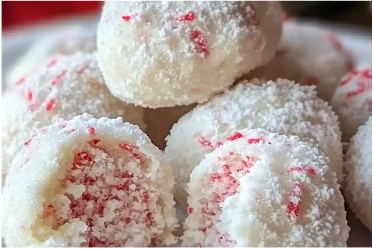 Plate of Peppermint Snowball Cookies dusted with powdered sugar