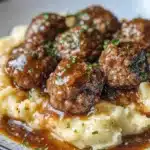 Salisbury Steak Meatballs with Garlic Herb Mashed Potatoes 36 salisbury steak meatballs with garlic herb mashed 2026 01 11 003605 819x1024 1